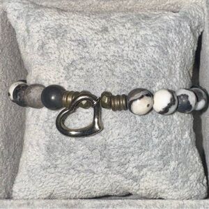 Tiffany Jazelle- Black and white bracelet with silver heart charm.